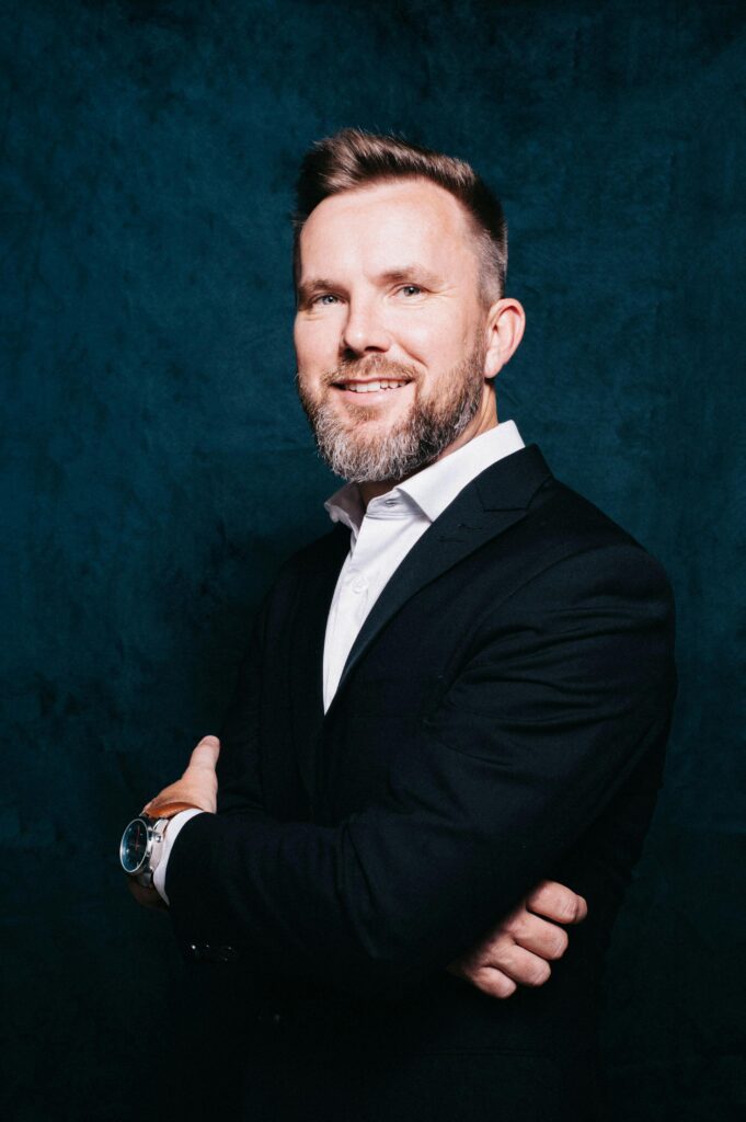 Portrait of a confident businessman in a suit, exuding professionalism and success.